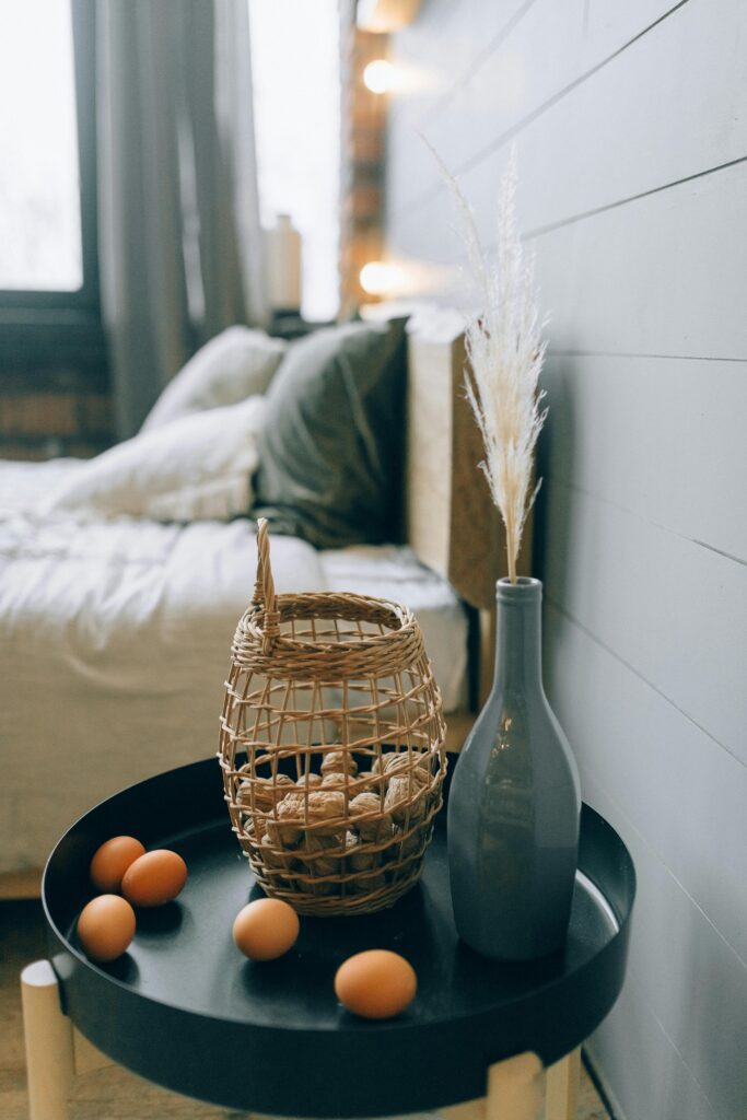 Rattan basket bedroom décor with natural textures and soft lighting creating a cozy, warm interior