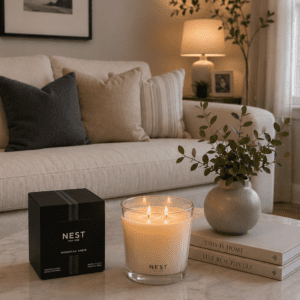 Luxury eucalyptus scented soy candle displayed on a marble coffee table.