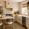 Bright white small kitchen with a wood island, woven bar stools, gold hardware, open shelves, and natural sunlight creating a cozy modern farmhouse look.