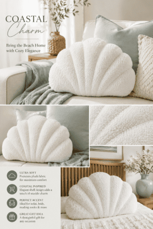 Soft white coastal shell throw pillow on a cozy sofa with sage green cushions and a knitted throw blanket, creating a relaxing beach-inspired living room.