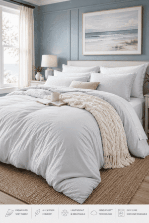 Soft white coastal comforter bedding set with matching pillow shams styled in a bright modern bedroom with beach-inspired décor.