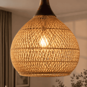 Handwoven rattan pendant light creating warm ambient lighting in a cozy bedroom with natural textures and organic decor.